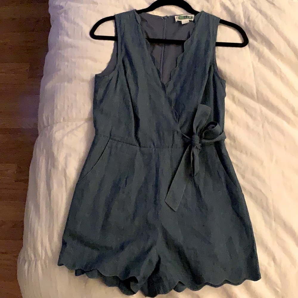 Denim romper with ruffle bottom and top